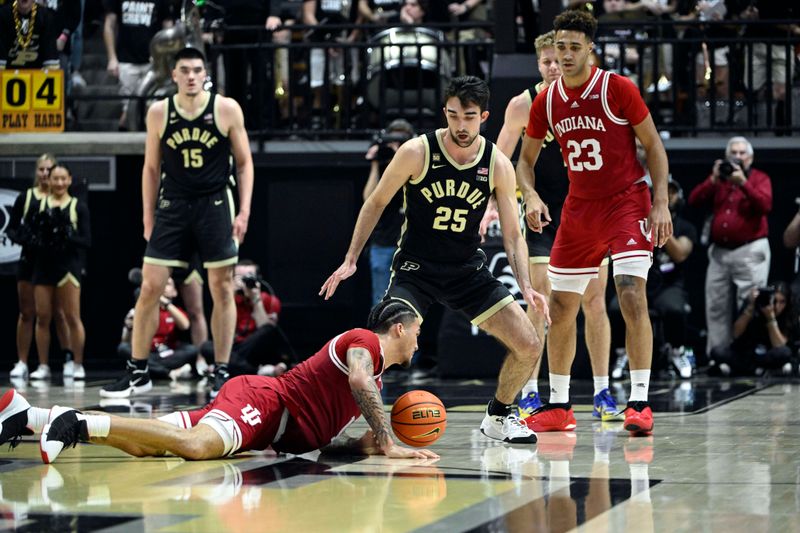 Feb 25, 2023; West Lafayette, Indiana, USA; Indiana Hoosiers guard Jalen Hood-Schifino (1) falls against Purdue Boilermakers guard Ethan Morton (25) during the second half at Mackey Arena. Indiana won 79-71. Mandatory Credit: Marc Lebryk-USA TODAY Sports