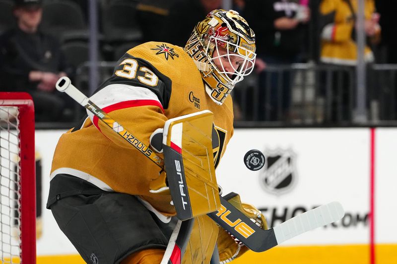 Mar 19, 2024; Las Vegas, Nevada, USA; Vegas Golden Knights goaltender Adin Hill (33) warms up before the start of a game against the Tampa Bay Lighting at T-Mobile Arena. Mandatory Credit: Stephen R. Sylvanie-USA TODAY Sports