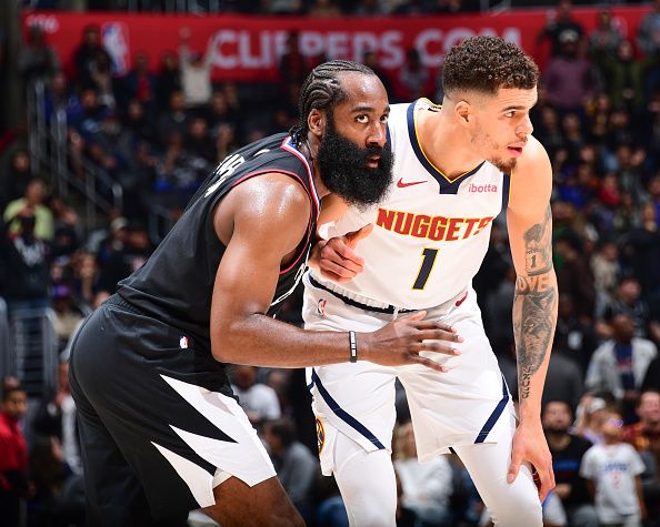 LOS ANGELES, CA - DECEMBER 6: James Harden #1 of the LA Clippers & Michael Porter Jr. #1 of the Denver Nuggets looks on during the game on December 6, 2023 at Crypto.Com Arena in Los Angeles, California. NOTE TO USER: User expressly acknowledges and agrees that, by downloading and/or using this Photograph, user is consenting to the terms and conditions of the Getty Images License Agreement. Mandatory Copyright Notice: Copyright 2023 NBAE (Photo by Adam Pantozzi/NBAE via Getty Images)