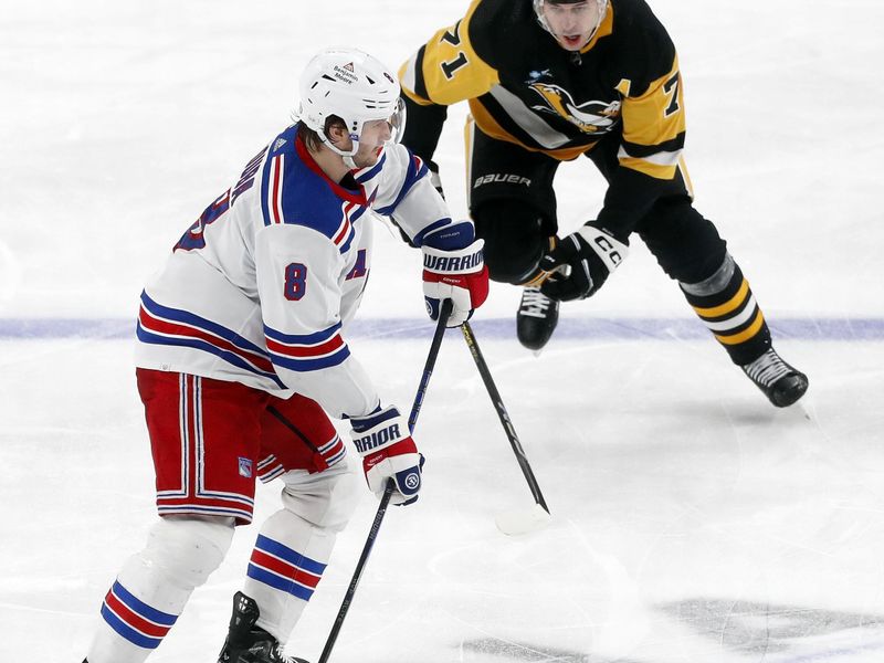 Nov 22, 2023; Pittsburgh, Pennsylvania, USA; New York Rangers defenseman Jacob Trouba (8) handles the puck against pressure from Pittsburgh Penguins center Evgeni Malkin (71) during the third period at PPG Paints Arena. The Rangers won 1-0. Mandatory Credit: Charles LeClaire-USA TODAY Sports