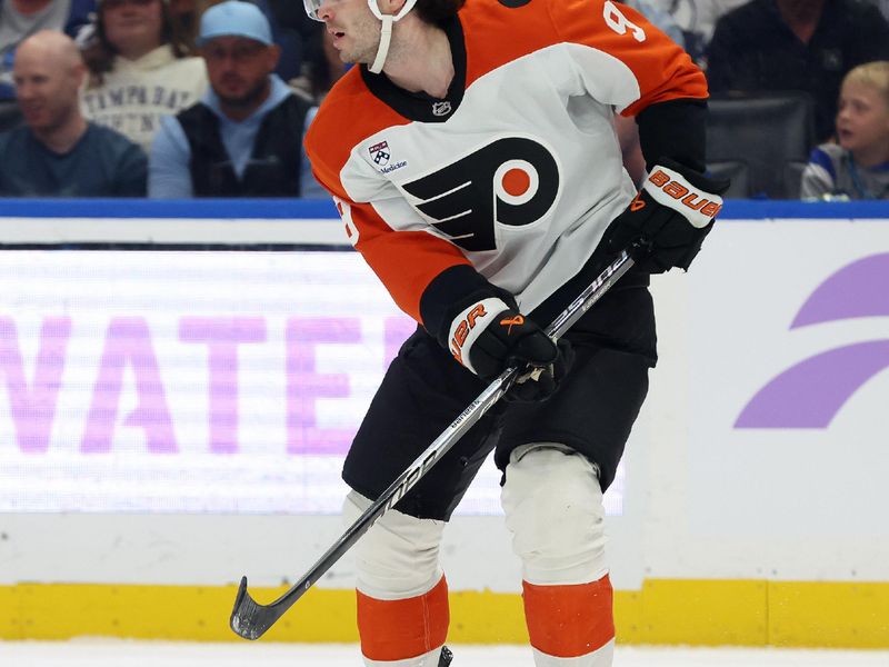 Nov 24, 2025; Tampa, Florida, USA; Philadelphia Flyers defenseman Jamie Drysdale (9) passes the puck against the Tampa Bay Lightning during the first period at Benchmark International Arena. Mandatory Credit: Kim Klement Neitzel-Imagn Images