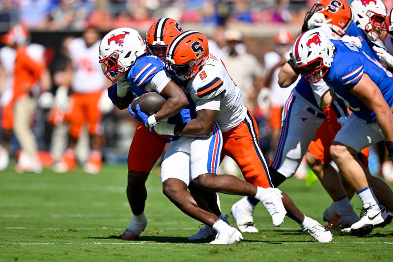 Oct 4, 2025; Dallas, Texas, USA; SMU Mustangs running back Dramekco Green (21) is tackled by Syracuse Orange defensive lineman David Reese (8) during the first half at Gerald J. Ford Stadium. Mandatory Credit: Jerome Miron-Imagn Images