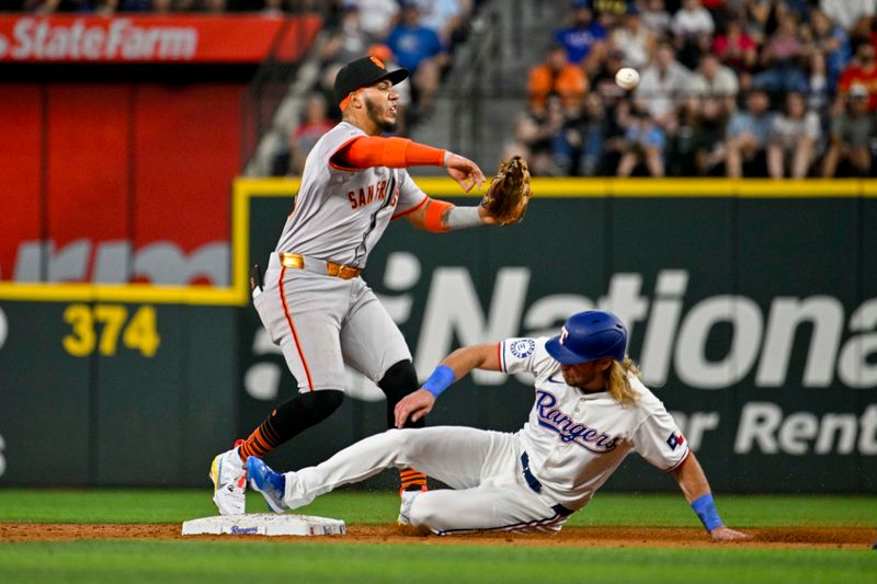 Jun 8, 2024; Arlington, Texas, USA; Texas Rangers left fielder Travis Jankowski (16) breaks up a double play to San Francisco Giants second baseman Thairo Estrada (39) during the second inning at Globe Life Field. Mandatory Credit: Jerome Miron-USA TODAY Sports