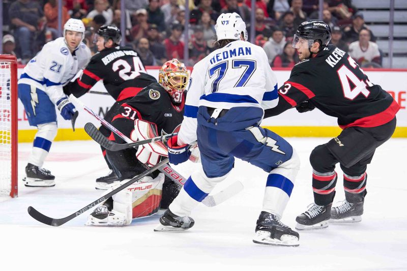 Oct 19, 2024; Ottawa, Ontario, CAN; Tampa Bay Lightning defenseman Victor Hedman (77) battles for position in front of Ottawa Senators goalie Anton Forsberg (31) in the second period at the Canadian Tire Centre. Mandatory Credit: Marc DesRosiers-Imagn Images