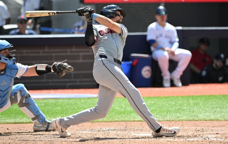 Jun 16, 2024; Toronto, Ontario, CAN;  Cleveland Guardians third baseman Daniel Schneemann (10) hits a two run home run against the Toronto Blue Jays in the sixth inning at Rogers Centre. Mandatory Credit: Dan Hamilton-USA TODAY Sports