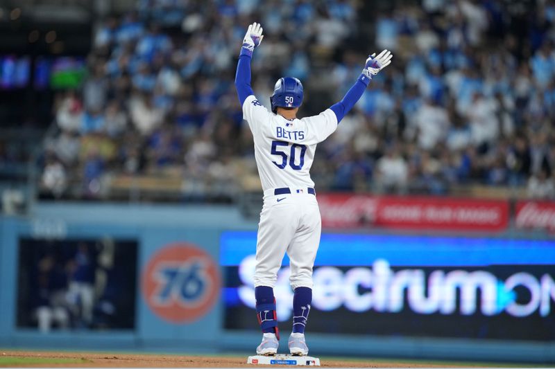 Sep 20, 2023; Los Angeles, California, USA; Los Angeles Dodgers second baseman Mookie Betts (50) gestures after hitting a double in the eighth inning against the Detroit Tigers at Dodger Stadium. Mandatory Credit: Kirby Lee-USA TODAY Sports