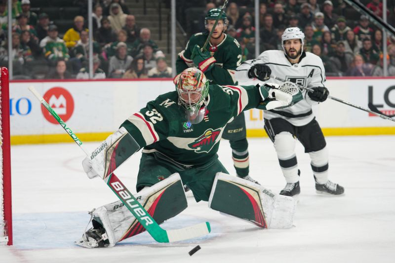 Feb 21, 2023; Saint Paul, Minnesota, USA; Minnesota Wild goaltender Filip Gustavsson (32) blocks a shot against the Los Angeles Kings in the first period at Xcel Energy Center. Mandatory Credit: Matt Blewett-USA TODAY Sports