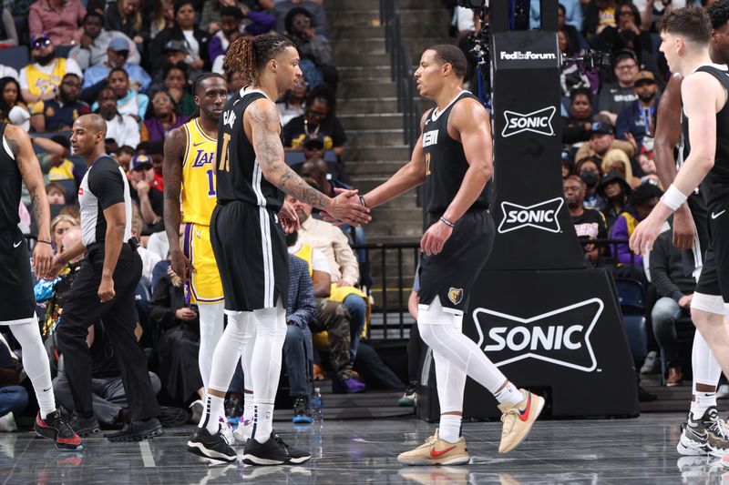 MEMPHIS, TN - MARCH 27: Brandon Clarke #15 of the Memphis Grizzlies and Desmond Bane #22 of the Memphis Grizzlies high five during the game against the Los Angeles Lakers on March 27, 2024 at FedExForum in Memphis, Tennessee. NOTE TO USER: User expressly acknowledges and agrees that, by downloading and or using this photograph, User is consenting to the terms and conditions of the Getty Images License Agreement. Mandatory Copyright Notice: Copyright 2024 NBAE (Photo by Joe Murphy/NBAE via Getty Images)