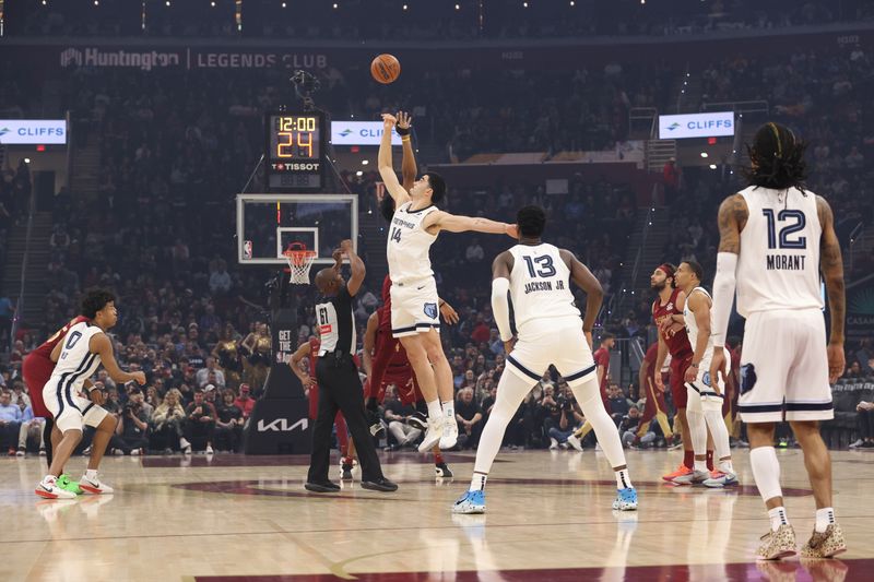 CLEVELAND, OH - FEBRUARY 23: Jarrett Allen #31 of the Cleveland Cavaliers and Zach Edey #14 of the Memphis Grizzlies go up for the opening tip off on February 23, 2025 at Rocket Arena in Cleveland, Ohio. NOTE TO USER: User expressly acknowledges and agrees that, by downloading and/or using this Photograph, user is consenting to the terms and conditions of the Getty Images License Agreement. Mandatory Copyright Notice: Copyright 2025 NBAE (Photo by Joe Murphy/NBAE via Getty Images)