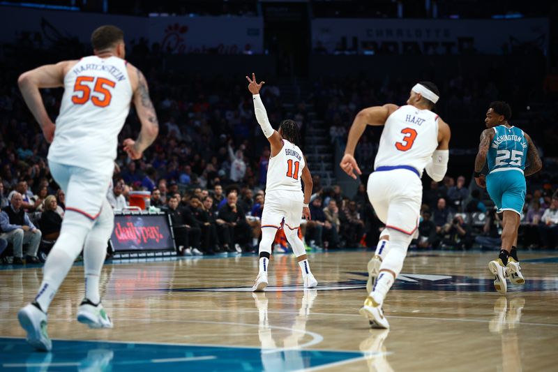 CHARLOTTE, NORTH CAROLINA - JANUARY 29: Jalen Brunson #11 of the New York Knicks reacts following a three point basket during the second half of the game against the Charlotte Hornets at Spectrum Center on January 29, 2024 in Charlotte, North Carolina. NOTE TO USER: User expressly acknowledges and agrees that, by downloading and or using this photograph, User is consenting to the terms and conditions of the Getty Images License Agreement. (Photo by Jared C. Tilton/Getty Images)