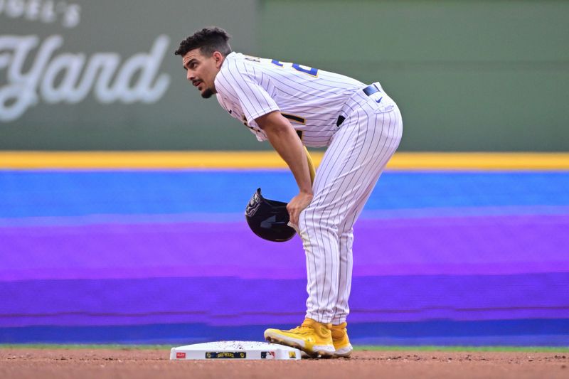 Sep 3, 2023; Milwaukee, Wisconsin, USA;  Milwaukee Brewers shortstop Willy Adames (27) catches his breath after reaching second base in the first inning against the Philadelphia Phillies at American Family Field. Mandatory Credit: Benny Sieu-USA TODAY Sports