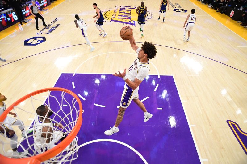 LOS ANGELES, CA - MACH 16: Jaxson Hayes #11 of the Los Angeles Lakers rebounds the ball during the game against the Golden State Warriors on March 16, 2024 at Crypto.Com Arena in Los Angeles, California. NOTE TO USER: User expressly acknowledges and agrees that, by downloading and/or using this Photograph, user is consenting to the terms and conditions of the Getty Images License Agreement. Mandatory Copyright Notice: Copyright 2024 NBAE (Photo by Adam Pantozzi/NBAE via Getty Images)