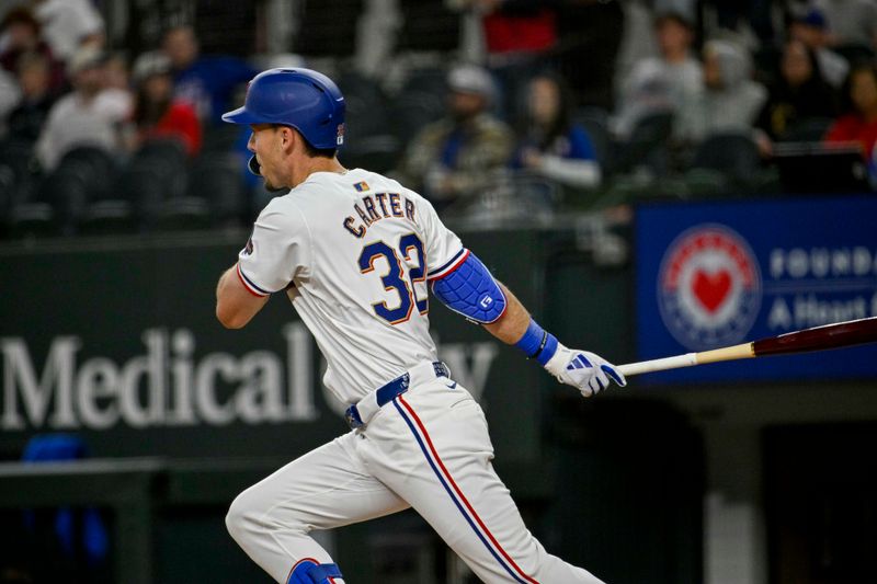 Apr 10, 2024; Arlington, Texas, USA; Texas Rangers left fielder Evan Carter (32) hits a double against the Oakland Athletics during the first inning at Globe Life Field. Mandatory Credit: Jerome Miron-USA TODAY Sports