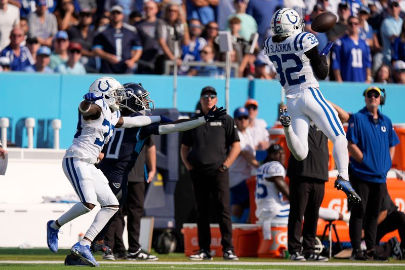 Indianapolis Colts safety Julian Blackmon (32) makes an interception during the second half of an NFL football game against the Tennessee Titans, Sunday, Oct. 13, 2024, in Nashville, Tenn. (AP Photo/George Walker IV)