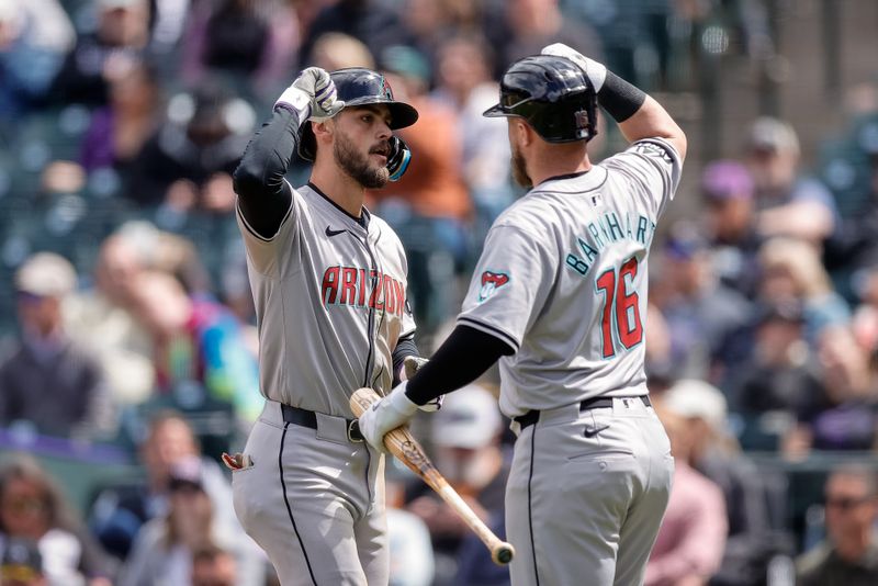 Apr 10, 2024; Denver, Colorado, USA; Arizona Diamondbacks shortstop Blaze Alexander (9) celebrates with catcher Tucker Barnhart (16) after hitting a solo home run in the second inning against the Colorado Rockies at Coors Field. Mandatory Credit: Isaiah J. Downing-USA TODAY Sports