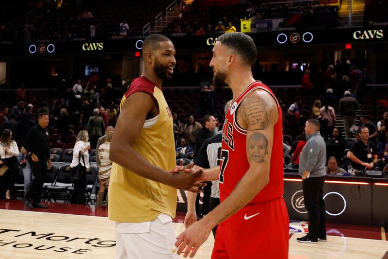 CLEVELAND, OH - OCTOBER 22: Chris Duarte #27 of the Chicago Bulls shakes hands with Tristan Thompson #13 of the Cleveland Cavaliers after the game during a NBA Preseason game on October 22, 2024 at Rocket Mortgage FieldHouse in Cleveland, Ohio. NOTE TO USER: User expressly acknowledges and agrees that, by downloading and/or using this Photograph, user is consenting to the terms and conditions of the Getty Images License Agreement. Mandatory Copyright Notice: Copyright 2024 NBAE (Photo by  Lauren Leigh Bacho/NBAE via Getty Images)