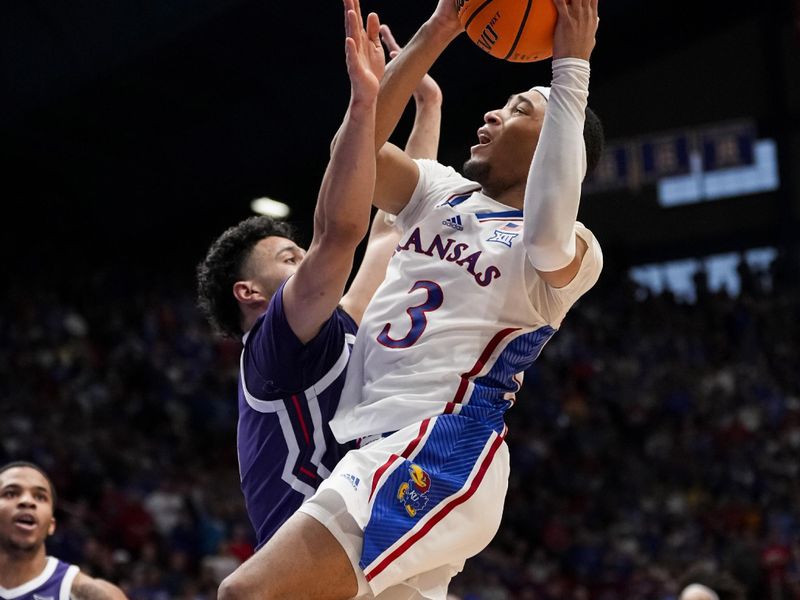 Jan 6, 2024; Lawrence, Kansas, USA; Kansas Jayhawks guard Dajuan Harris Jr. (3) goes up for a shot against TCU Horned Frogs guard Trevian Tennyson (11) during the second half at Allen Fieldhouse. Mandatory Credit: Jay Biggerstaff-USA TODAY Sports