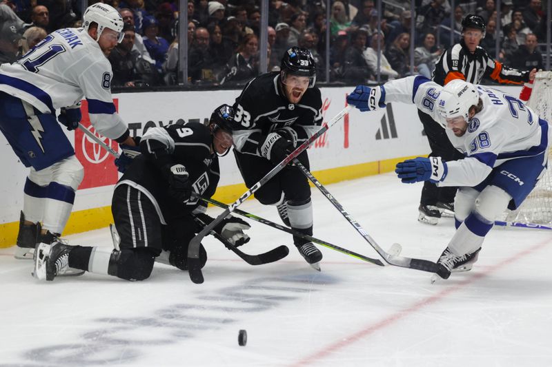 sMar 23, 2024; Los Angeles, California, USA; Los Angeles Kings goalie Cam Talbot (33) pursues the puck as Tampa Bay Lighting left wing Brandon Hagel (38) defends during the second period of an NHL hockey game at Crypto.com Arena. Mandatory Credit: Yannick Peterhans-USA TODAY Sports