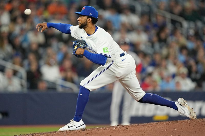 Apr 29, 2025; Toronto, Ontario, CAN; Toronto Blue Jays pitcher Dillon Tate pitches to the Boston Red Sox during the fifth inning at Rogers Centre. Mandatory Credit: John E. Sokolowski-Imagn Images