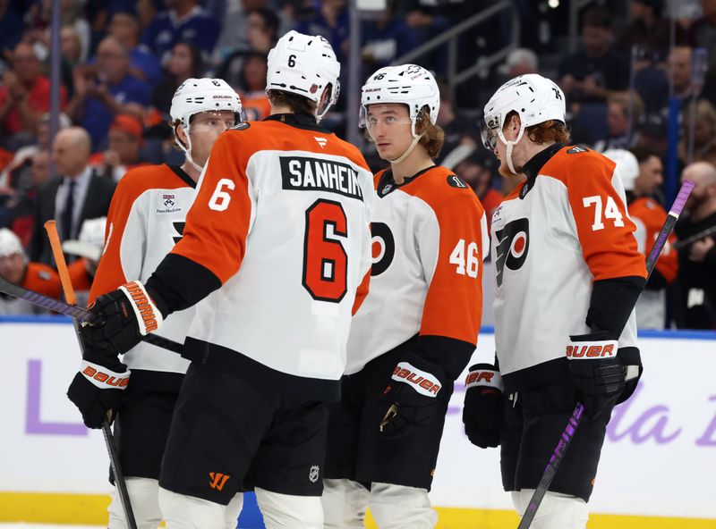 Nov 24, 2025; Tampa, Florida, USA; Philadelphia Flyers defenseman Travis Sanheim (6) talks with defenseman Cam York (8) and center Trevor Zegras (46) against the Tampa Bay Lightning during the second period at Benchmark International Arena. Mandatory Credit: Kim Klement Neitzel-Imagn Images