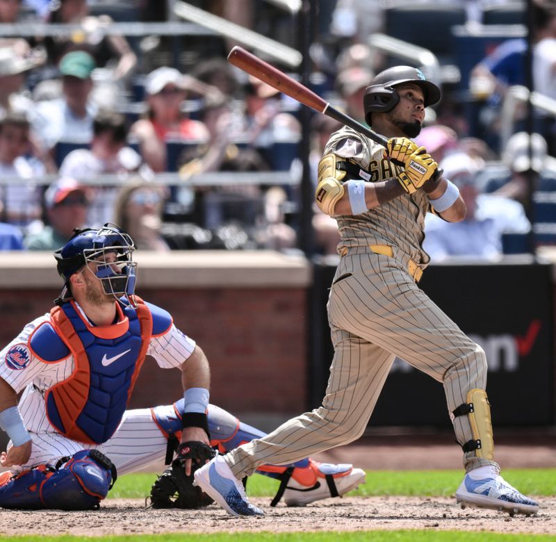 Jun 16, 2024; New York City, New York, USA; San Diego Padres second baseman Luis Arraez (4) hits a double against the New York Mets during the fifth inning at Citi Field. Mandatory Credit: John Jones-USA TODAY Sports