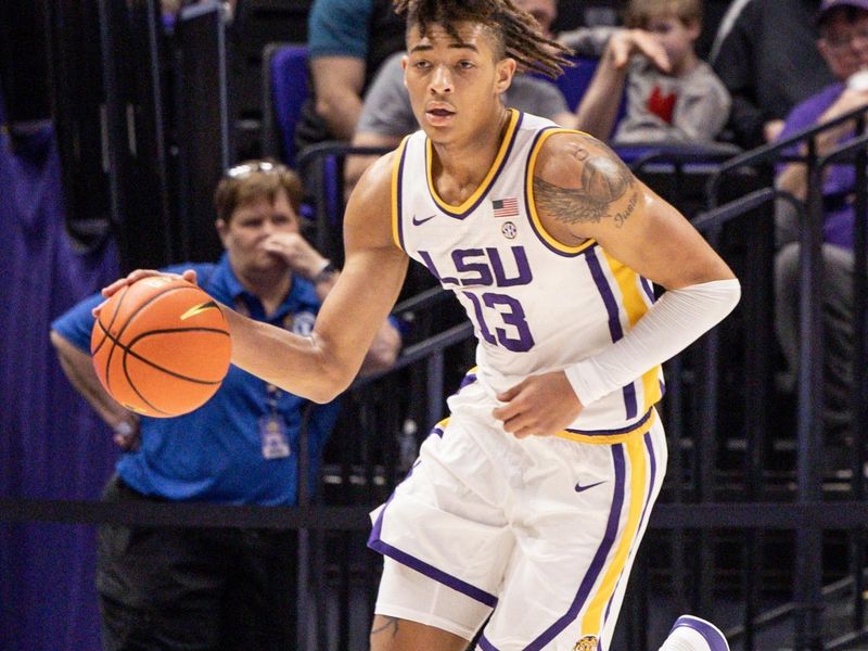 Nov 27, 2022; Baton Rouge, Louisiana, USA;  LSU Tigers forward Jalen Reed (13) dribbles against the Wofford Terriers during the first half at Pete Maravich Assembly Center. Mandatory Credit: Stephen Lew-USA TODAY Sports