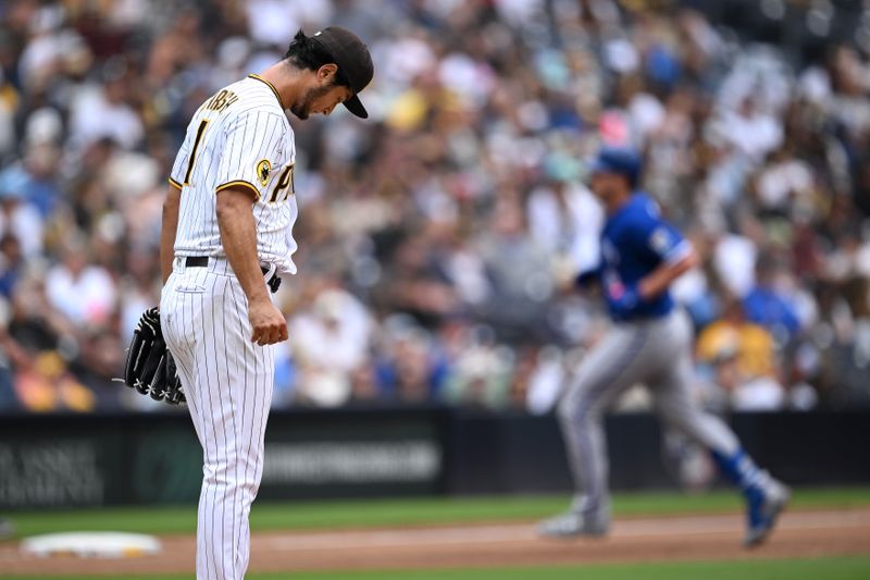 May 17, 2023; San Diego, California, USA; San Diego Padres starting pitcher Yu Darvish (11) looks down as Kansas City Royals designated hitter Vinnie Pasquantino (right) rounds the bases after hitting a two-run home run during the sixth inning at Petco Park. Mandatory Credit: Orlando Ramirez-USA TODAY Sports