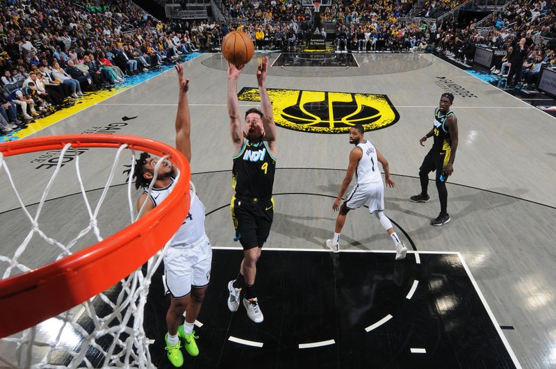 INDIANAPOLIS, IN - MARCH 16: T.J. McConnell #9 of the Indiana Pacers shoots the ball during the game against the Brooklyn Nets on March 16, 2024 at Gainbridge Fieldhouse in Indianapolis, Indiana. NOTE TO USER: User expressly acknowledges and agrees that, by downloading and or using this Photograph, user is consenting to the terms and conditions of the Getty Images License Agreement. Mandatory Copyright Notice: Copyright 2024 NBAE (Photo by Ron Hoskins/NBAE via Getty Images)