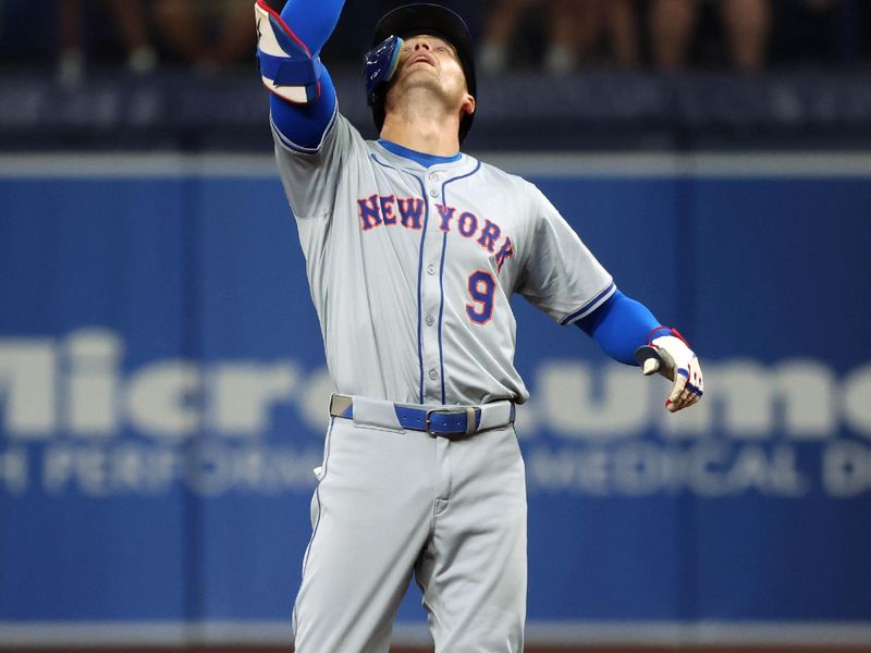 May 4, 2024; St. Petersburg, Florida, USA;  New York Mets outfielder Brandon Nimmo (9) celebrates after he doubles against the Tampa Bay Rays during the first inning at Tropicana Field. Mandatory Credit: Kim Klement Neitzel-USA TODAY Sports