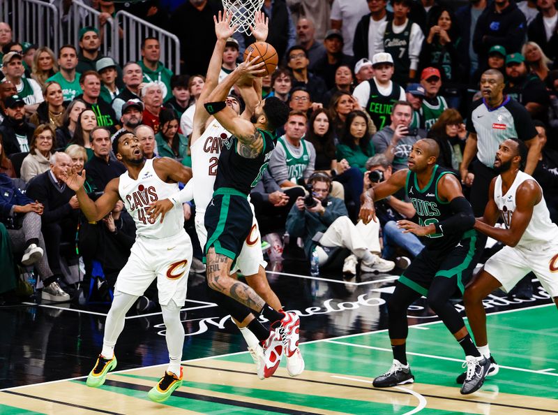 BOSTON, MASSACHUSETTS - NOVEMBER 19: Jayson Tatum #0 of the Boston Celtics shoots against Donovan Mitchell #45 and Georges Niang #20 of the Cleveland Cavaliers during the fourth quarter of the Emirates NBA Cup at TD Garden on November 19, 2024 in Boston, Massachusetts. The Celtics won 120-117. NOTE TO USER: User expressly acknowledges and agrees that, by downloading and or using this photograph, User is consenting to the terms and conditions of the Getty Images License Agreement.  (Photo by Winslow Townson/Getty Images)