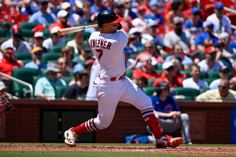 Jul 30, 2023; St. Louis, Missouri, USA;  St. Louis Cardinals catcher Andrew Knizner (7) hits a one run single against the Chicago Cubs during the second inning at Busch Stadium. Mandatory Credit: Jeff Curry-USA TODAY Sports