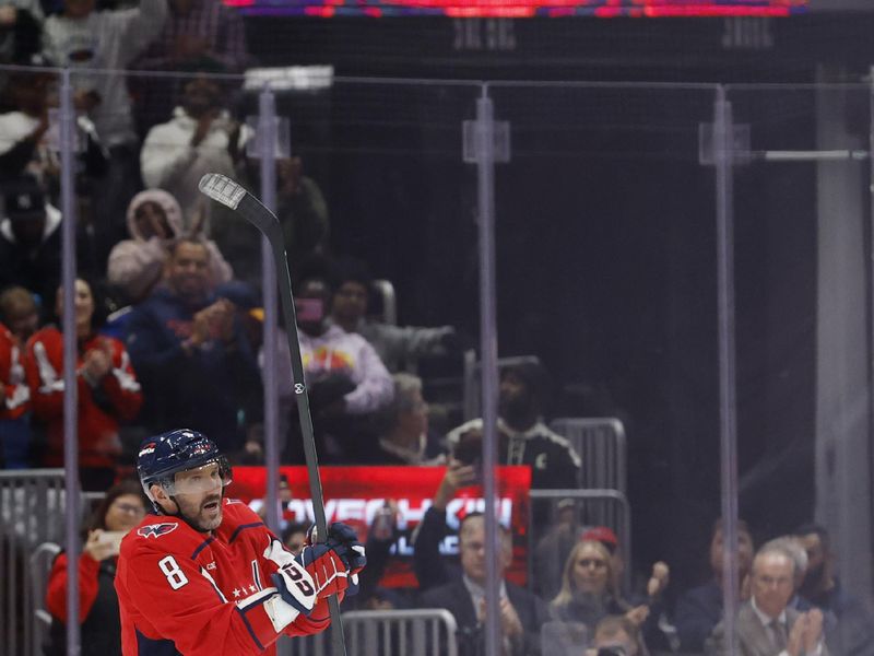 Nov 5, 2025; Washington, District of Columbia, USA; Washington Capitals left wing Alex Ovechkin (8) waves to the crowd after scoring his 900th NHL goal, against the St. Louis Blues, during the second period at Capital One Arena. Mandatory Credit: Geoff Burke-Imagn Images