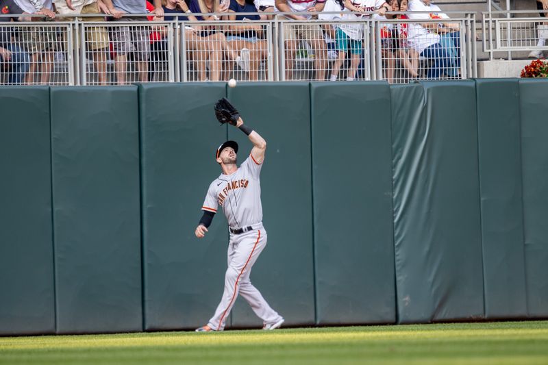 May 23, 2023; Minneapolis, Minnesota, USA; San Francisco Giants left fielder Mitch Haniger (17) catches a fly ball in the first inning against the Minnesota Twins at Target Field. Mandatory Credit: Jesse Johnson-USA TODAY Sports