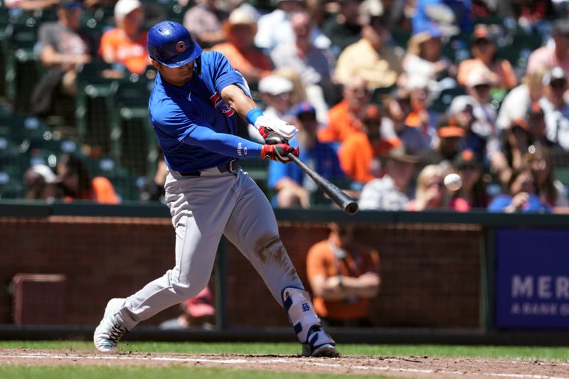 Jun 27, 2024; San Francisco, California, USA; Chicago Cubs left fielder Seiya Suzuki (27) hits a double against the San Francisco Giants during the eighth inning at Oracle Park. Mandatory Credit: Darren Yamashita-USA TODAY Sports