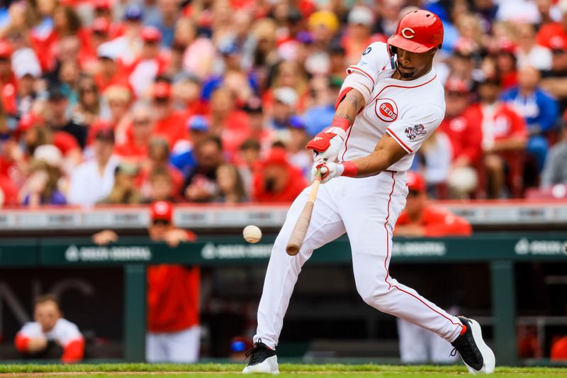 May 25, 2025; Cincinnati, Ohio, USA; Cincinnati Reds outfielder Will Benson (30) hits a RBI single in the first inning against the Chicago Cubs at Great American Ball Park. Mandatory Credit: Katie Stratman-Imagn Images