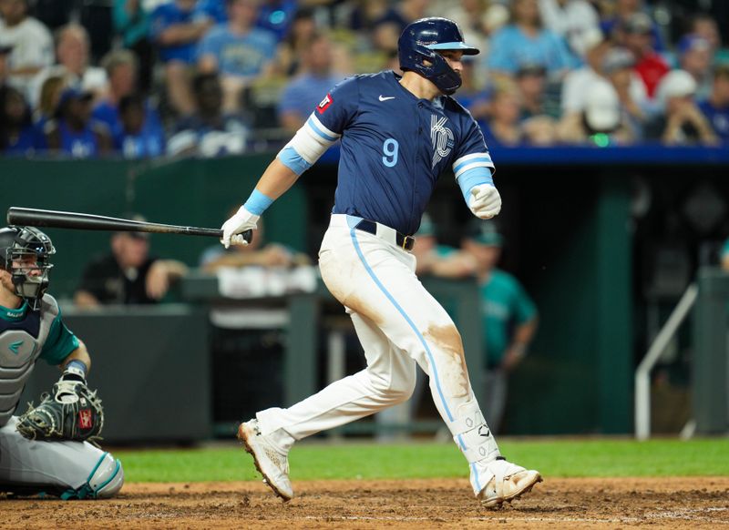 Jun 7, 2024; Kansas City, Missouri, USA; Kansas City Royals first baseman Vinnie Pasquantino (9) hits a single during the sixth inning against the Seattle Mariners at Kauffman Stadium. Mandatory Credit: Jay Biggerstaff-USA TODAY Sports