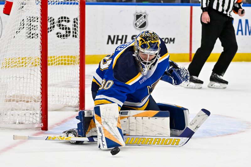 Jan 15, 2024; St. Louis, Missouri, USA;  St. Louis Blues goaltender Joel Hofer (30) defends the net against the Philadelphia Flyers during the third period at Enterprise Center. Mandatory Credit: Jeff Curry-USA TODAY Sports