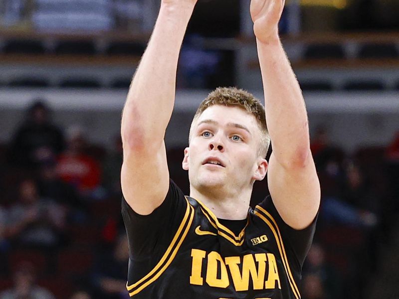 Mar 12, 2026; Chicago, IL, USA; Iowa Hawkeyes guard Bennett Stirtz (14) shoots against the Ohio State Buckeyes during the first half at United Center. Mandatory Credit: Kamil Krzaczynski-Imagn Images