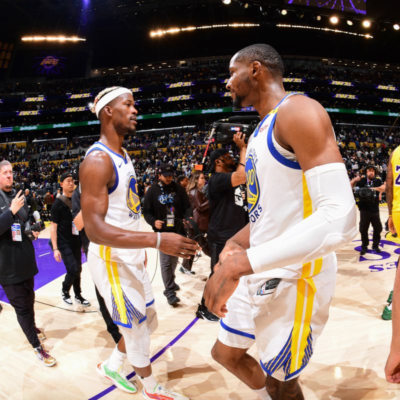 LOS ANGELES, CA - APRIL 3:    Jimmy Butler #10 and Jonathan Kuminga #00 of the Golden State Warriors celebrate after the game against the Los Angeles Lakers on April 3, 2025 at Crypto.Com Arena in Los Angeles, California. NOTE TO USER: User expressly acknowledges and agrees that, by downloading and/or using this Photograph, user is consenting to the terms and conditions of the Getty Images License Agreement. Mandatory Copyright Notice: Copyright 2025 NBAE (Photo by Adam Pantozzi/NBAE via Getty Images)