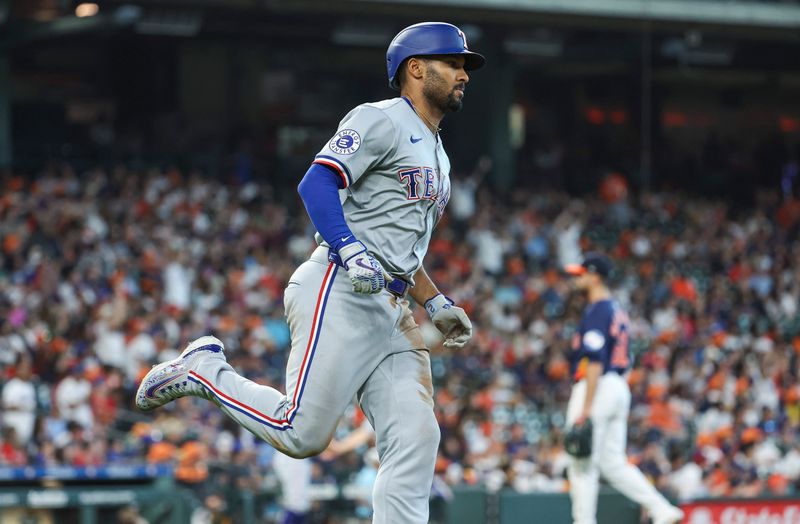 Apr 14, 2024; Houston, Texas, USA; Houston Astros pitcher Seth Martinez (61) reacts and Texas Rangers second baseman Marcus Semien (2) rounds the bases after hitting a three-run home run during the ninth inning at Minute Maid Park. Mandatory Credit: Troy Taormina-USA TODAY Sports