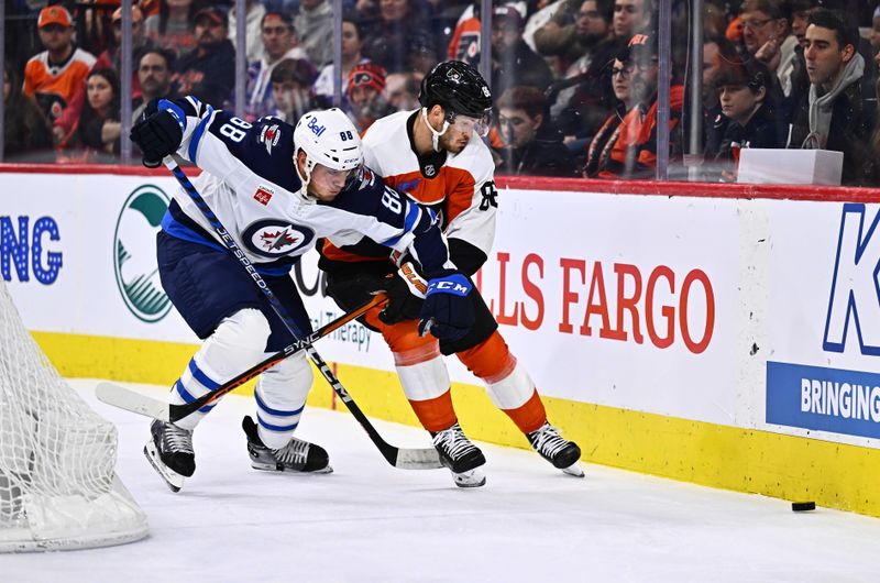 Feb 8, 2024; Philadelphia, Pennsylvania, USA; Winnipeg Jets defenseman Nate Schmidt (88) and Philadelphia Flyers left wing Joel Farabee (86) battle for the puck in the first period at Wells Fargo Center. Mandatory Credit: Kyle Ross-USA TODAY Sports