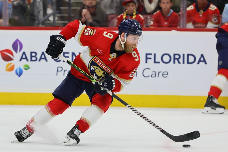 May 26, 2024; Sunrise, Florida, USA; Florida Panthers center Sam Bennett (9) moves the puck against the New York Rangers during the third period in game three of the Eastern Conference Final of the 2024 Stanley Cup Playoffs at Amerant Bank Arena. Mandatory Credit: Sam Navarro-USA TODAY Sports