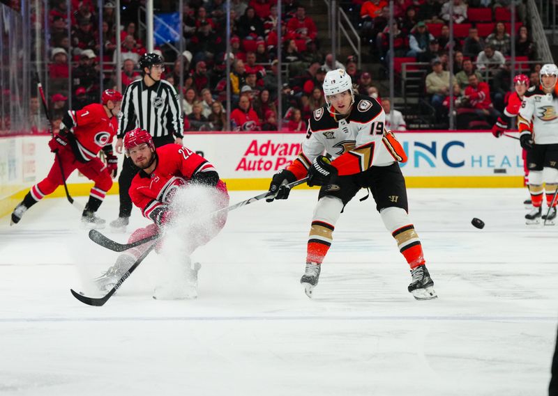 Jan 11, 2024; Raleigh, North Carolina, USA; Carolina Hurricanes right wing Stefan Noesen (23) shoots the puck in past Anaheim Ducks right wing Troy Terry (19) during the first period at PNC Arena. Mandatory Credit: James Guillory-USA TODAY Sports