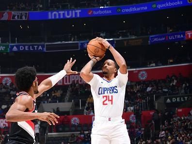 LOS ANGELES, CA - DECEMBER 11: Norman Powell #24 of the LA Clippers shoots a three point basket against the Portland Trail Blazers on December 11, 2023 at Crypto.Com Arena in Los Angeles, California. NOTE TO USER: User expressly acknowledges and agrees that, by downloading and/or using this Photograph, user is consenting to the terms and conditions of the Getty Images License Agreement. Mandatory Copyright Notice: Copyright 2023 NBAE (Photo by Adam Pantozzi/NBAE via Getty Images)