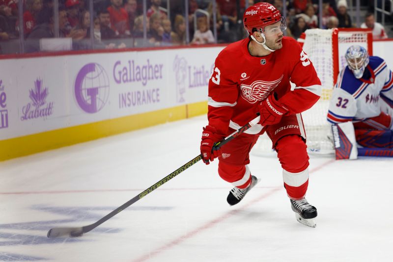 Nov 9, 2024; Detroit, Michigan, USA;  Detroit Red Wings right wing Alex DeBrincat (93) skates with the puck against the New York Rangers in the second period at Little Caesars Arena. Mandatory Credit: Rick Osentoski-Imagn Images