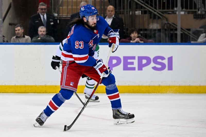 Jan 7, 2025; New York, New York, USA;  New York Rangers center Mika Zibanejad (93) attempts a shot against the Dallas Stars during the third period at Madison Square Garden. Mandatory Credit: Dennis Schneidler-Imagn Images
