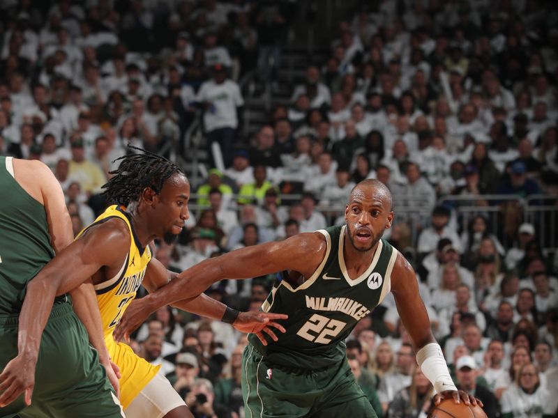 MILWAUKEE, WI - APRIL 23: Khris Middleton #22 of the Milwaukee Bucks dribbles the ball during the game against the Indiana Pacers during Round One Game Two of the 2024 NBA Playoffs on April 23, 2024 at the Fiserv Forum Center in Milwaukee, Wisconsin. NOTE TO USER: User expressly acknowledges and agrees that, by downloading and or using this Photograph, user is consenting to the terms and conditions of the Getty Images License Agreement. Mandatory Copyright Notice: Copyright 2024 NBAE (Photo by Gary Dineen/NBAE via Getty Images).