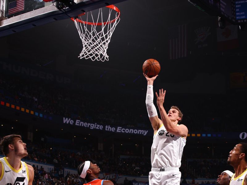 OKLAHOMA CITY, OK - DECEMBER 3: Lauri Markkanen #23 of the Utah Jazz drives to the basket during the game against the Oklahoma City Thunder during the Emirates NBA Cup game on on December 3, 2024 at Paycom Center in Oklahoma City, Oklahoma. NOTE TO USER: User expressly acknowledges and agrees that, by downloading and or using this photograph, User is consenting to the terms and conditions of the Getty Images License Agreement. Mandatory Copyright Notice: Copyright 2024 NBAE (Photo by Zach Beeker/NBAE via Getty Images)