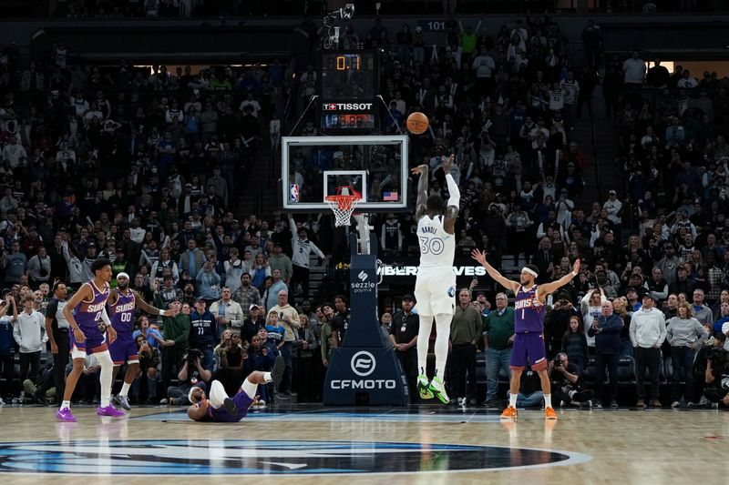 MINNEAPOLIS, MN -  NOVEMBER 17: Julius Randle #30 of the Minnesota Timberwolves makes the game winning three point buzzer beater basket during the game against the Phoenix Suns on November 17, 2024 at Target Center in Minneapolis, Minnesota. NOTE TO USER: User expressly acknowledges and agrees that, by downloading and or using this Photograph, user is consenting to the terms and conditions of the Getty Images License Agreement. Mandatory Copyright Notice: Copyright 2024 NBAE (Photo by Jordan Johnson/NBAE via Getty Images)