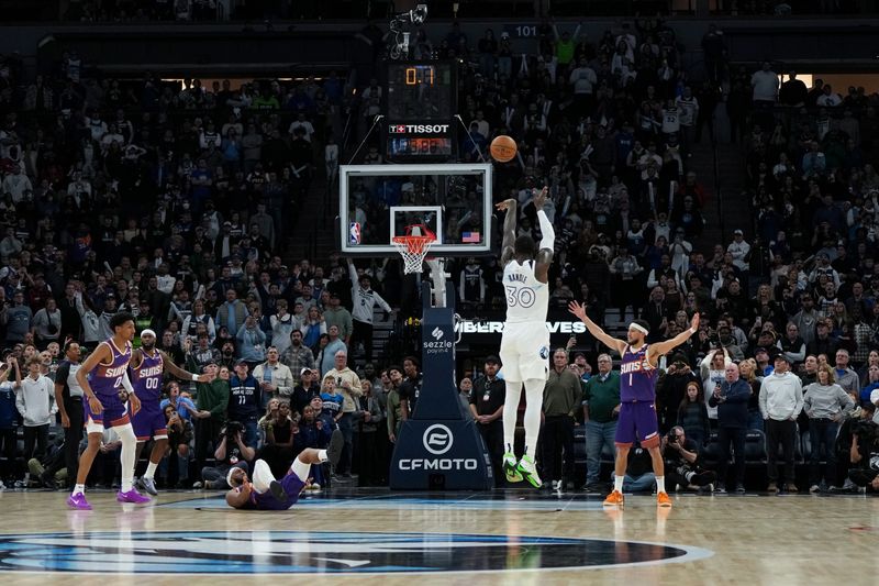 MINNEAPOLIS, MN -  NOVEMBER 17: Julius Randle #30 of the Minnesota Timberwolves makes the game winning three point buzzer beater basket during the game against the Phoenix Suns on November 17, 2024 at Target Center in Minneapolis, Minnesota. NOTE TO USER: User expressly acknowledges and agrees that, by downloading and or using this Photograph, user is consenting to the terms and conditions of the Getty Images License Agreement. Mandatory Copyright Notice: Copyright 2024 NBAE (Photo by Jordan Johnson/NBAE via Getty Images)